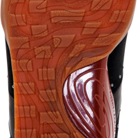 Close-up of the outsole of a sneaker, showing a textured orange-brown tread with a circular white heel area printed with the brand name 'oirex'.