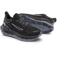 Black and gray running shoes on a white background