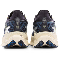 Pair of running shoes showing the sole design on a white background