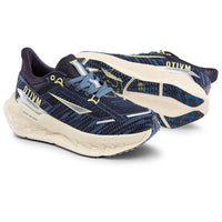Navy and beige running shoes with 'OTIVM' branding on a white background
