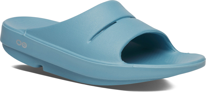 Quarter turn view Women's Oofos Footwear style name Ooahh Slide in color Ocean Blue. Sku: 1100OCEBLU