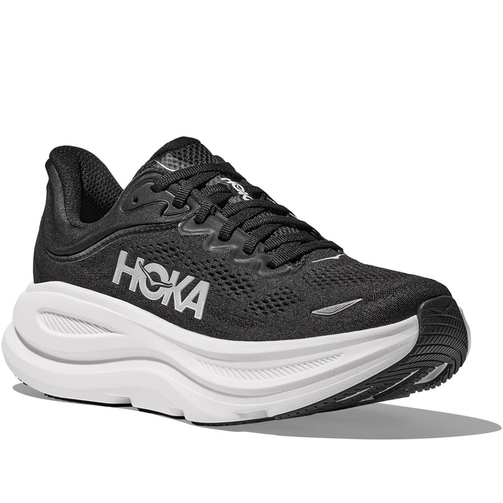 Quarter turn view Women's Hoka Footwear style name Bondi 9 Extra Wide in color Black/ White. Sku: 1162016-BWHT