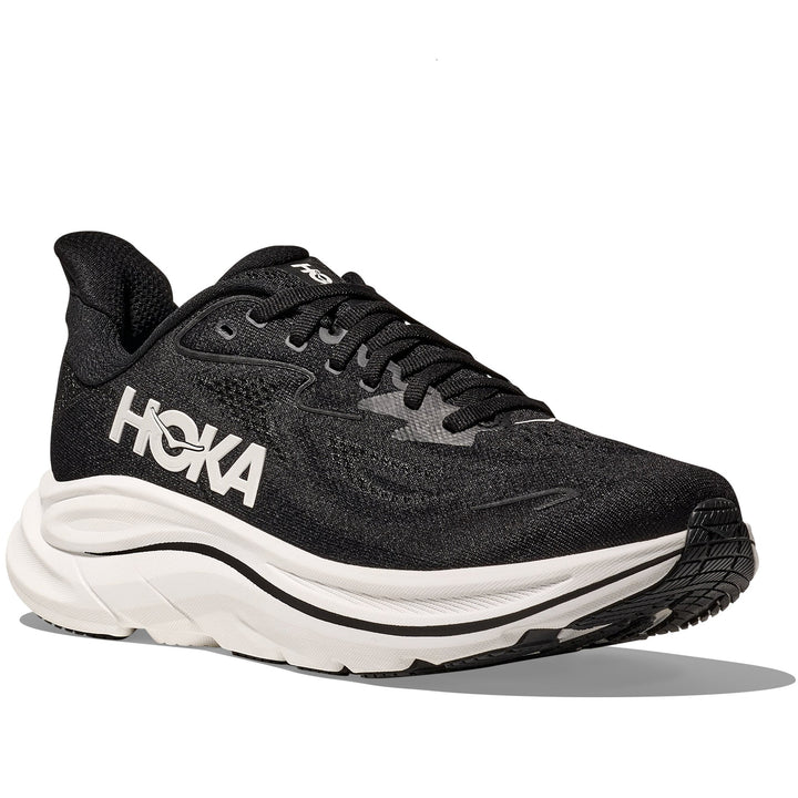 Quarter turn view Men's Hoka Footwear style name Clifton 10 Wide in color Black/ White. Sku: 1162032-BWHT