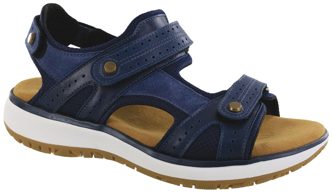 Blue sandal with brown sole on a white background