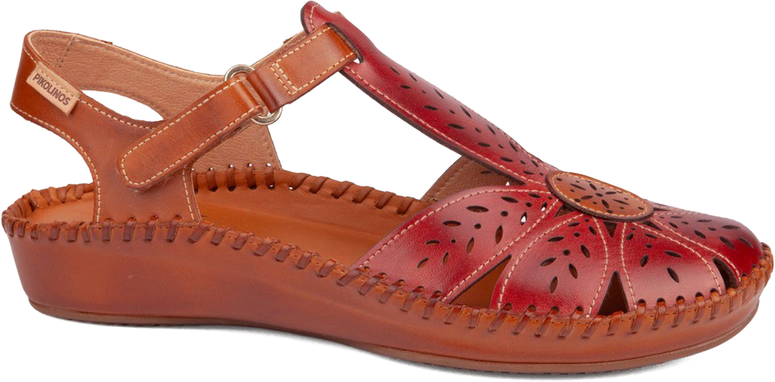 Red sandal with cut-out design on a white background