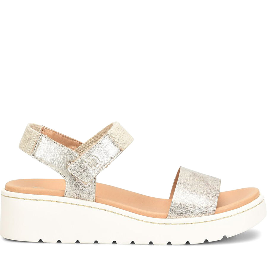 Quarter turn Women's BORN Footwear style name Kyla in color Light Gold. Sku: BR0072330