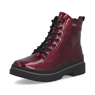 Red patent leather boot with black laces on a white background