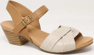 Beige sandal with a wooden heel on a white background