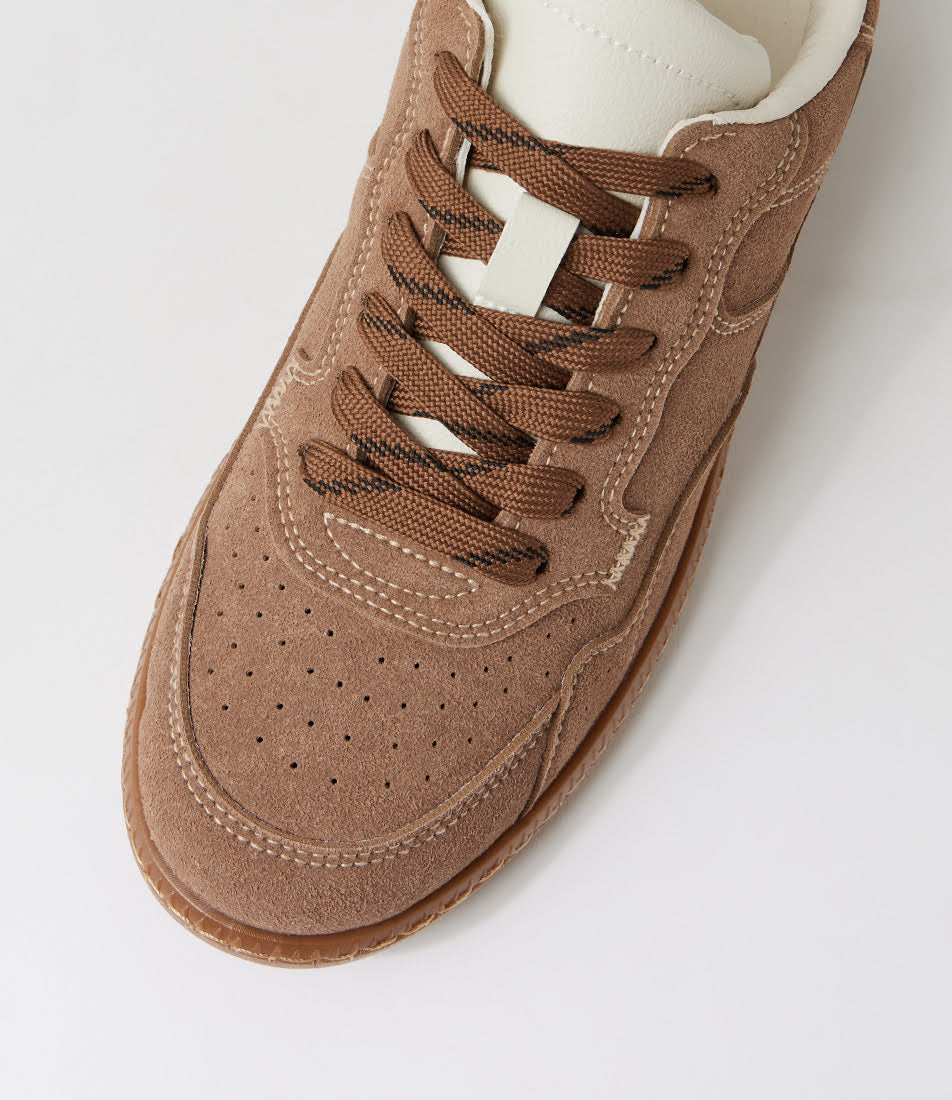 A close-up, top-down view of a brown suede sneaker with matching brown laces and a white collar, set against a clean white background.