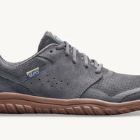 Gray sneaker with brown sole on a white background