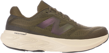 Green running shoe with New Balance logo on a white background