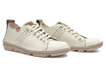 Pair of white sneakers with brown accents on a white background