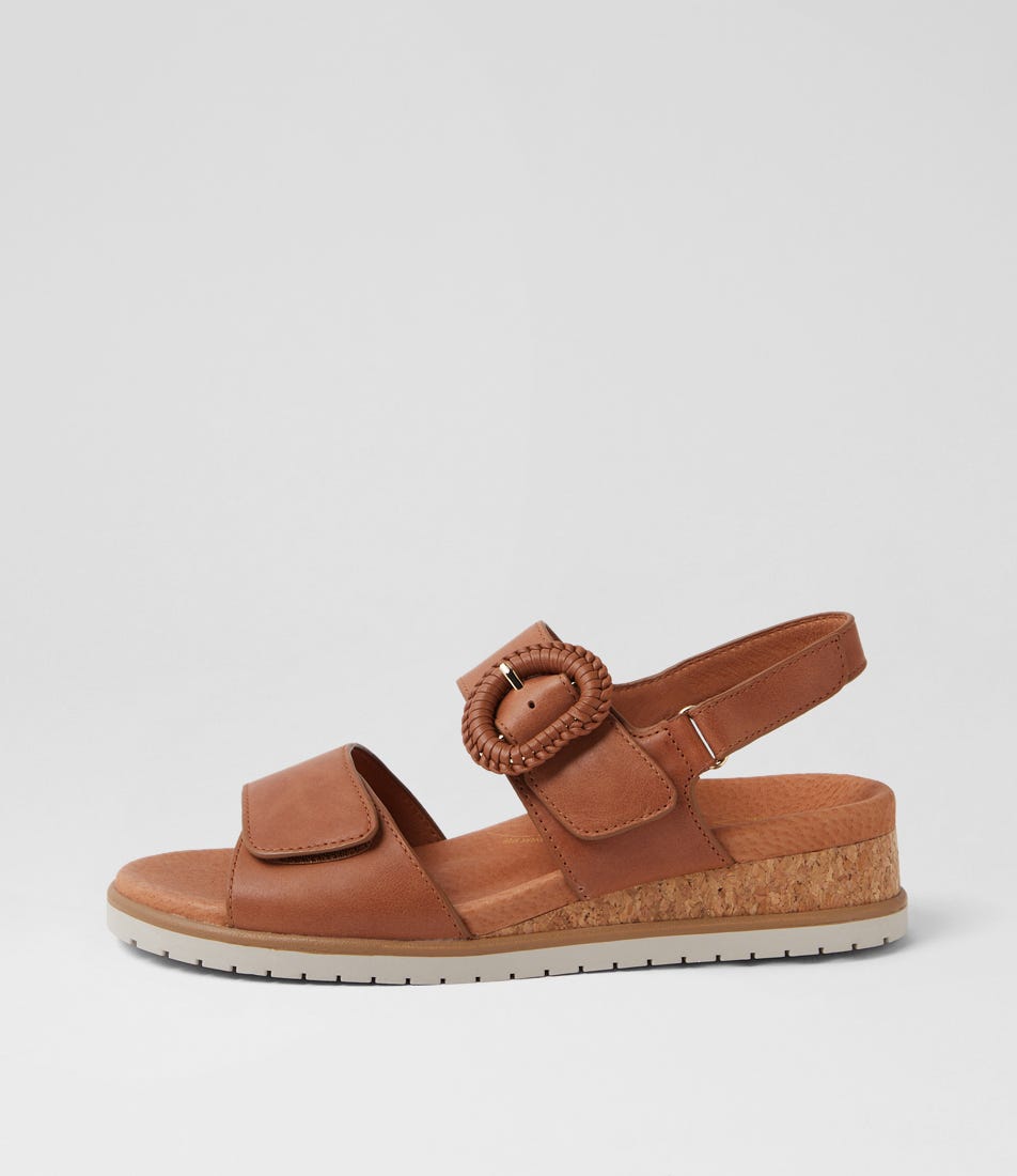 Ziera Vatch wedge sandal in tan leather with adjustable straps, cushioned footbed, and mid-height wedge sole on a white background